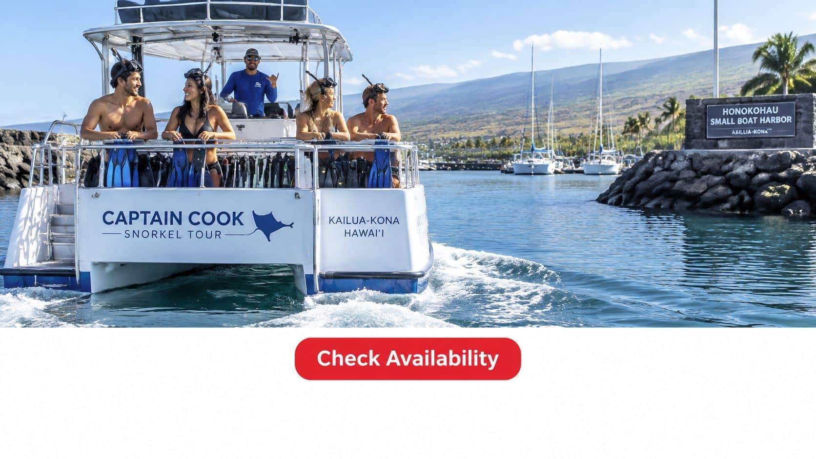 A group of people preparing for a snorkeling tour on a boat leaving Honokohau Small Boat Harbor.