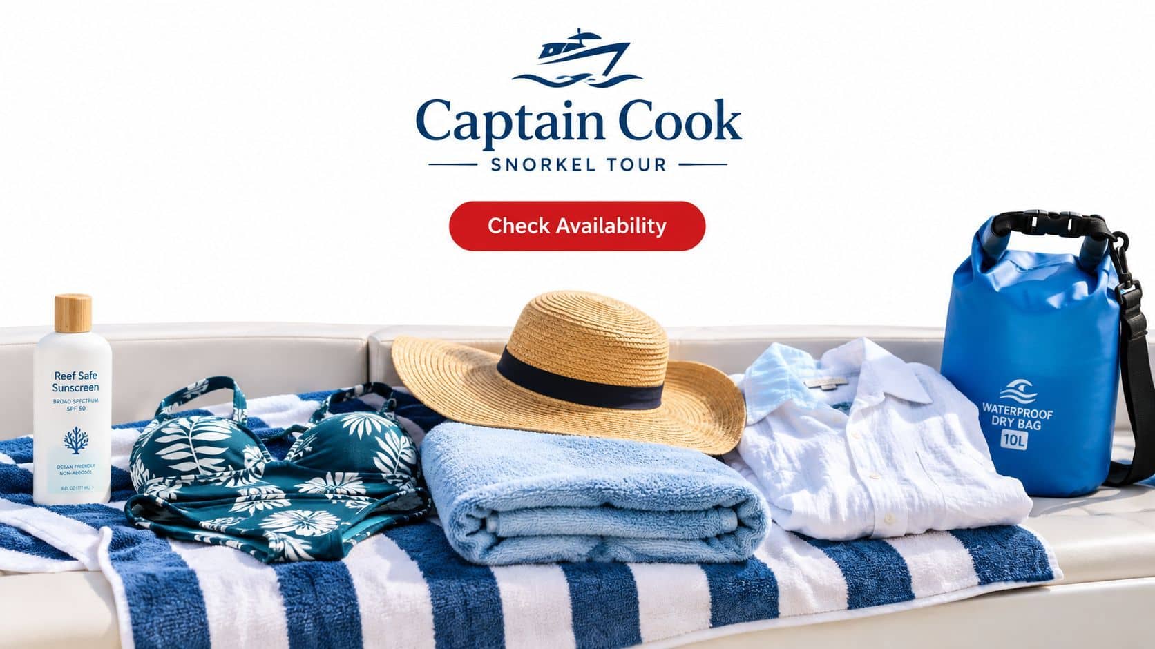 Essentials for a Captain Cook snorkel tour displayed on a beach towel atop a white boat bench.